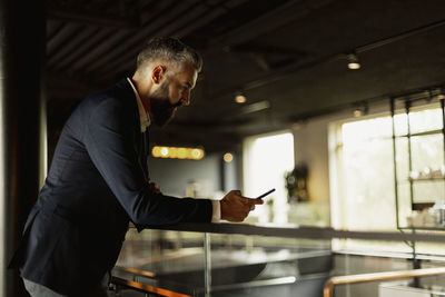 Businessman using cell phone