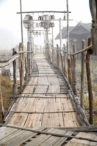 Empty footbridge along footpath