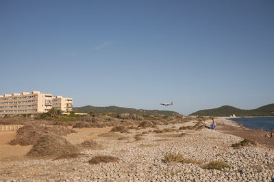 Scenic view of beach against clear sky