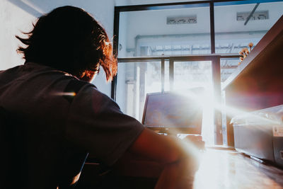 Close-up of man using computer on table