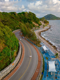 High angle view of road by mountain against sky