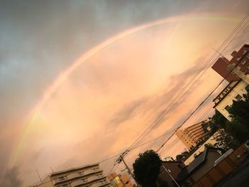Scenic view of rainbow over city