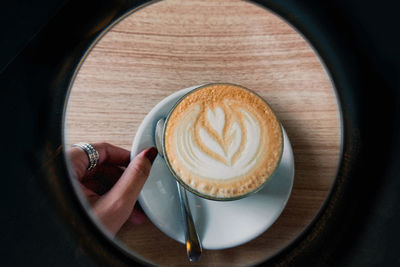 High angle view of cappuccino on table