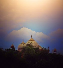 Temple building against sky during sunset