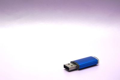 Close-up of usb stick against white background