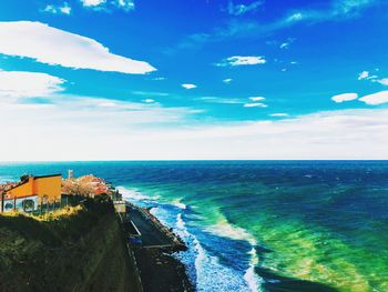 Scenic view of sea against blue sky