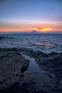 Scenic view of sea against sky during sunset