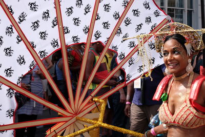 Young woman holding umbrella