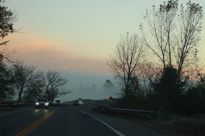 Cars on road against sky