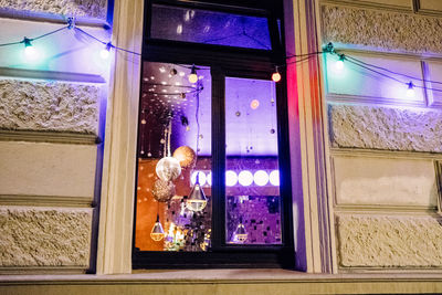 Reflection of woman on glass window