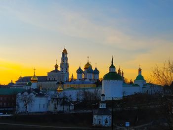 Buildings against sky during sunset