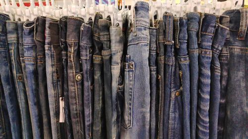 Close-up of clothes drying on wood