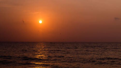 View of calm sea at sunset