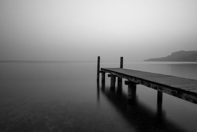 Pier over sea against sky