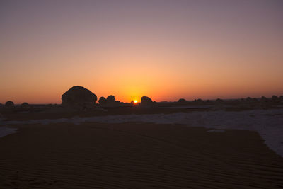 View of beach at sunset