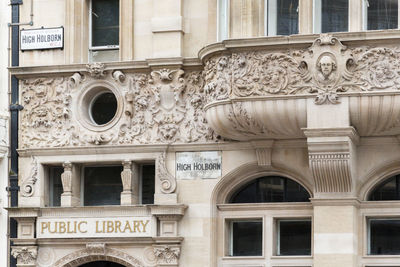 Low angle view of sculpture against building