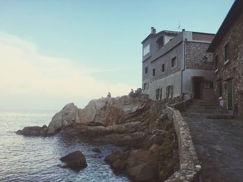 Panoramic view of sea and buildings against sky