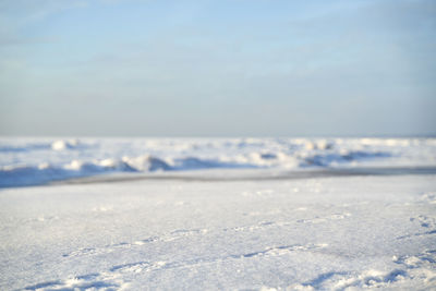 Scenic view of sea against sky during winter