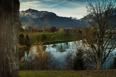 Scenic view of lake and mountains against sky