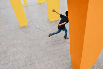 High angle view of boy running on street