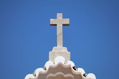 High angle view of religious cross on church roof