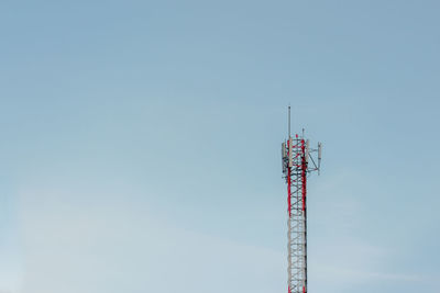 Low angle view of communications tower against sky