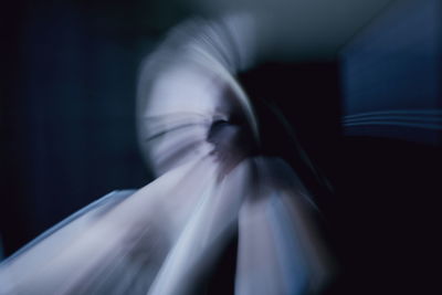 Digital composite image of blurred woman