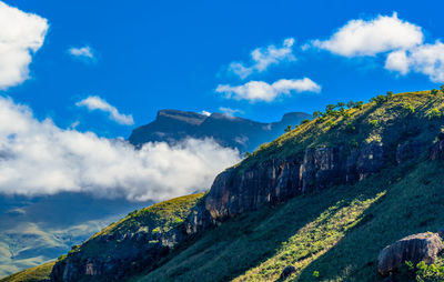 Scenic view of mountains against cloudy sky