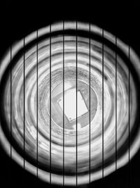 Directly below shot of metal fence against sky