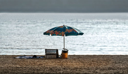 Umbrella on the beach against sea