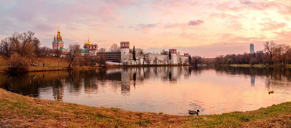Scenic view of lake against sky during sunset