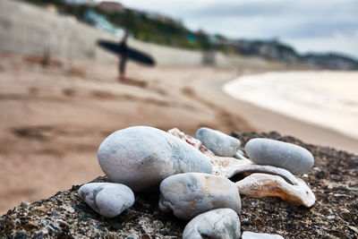 Close-up of stones on sand