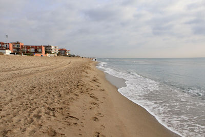 Scenic view of beach against sky