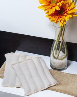 High angle view of white roses in vase on table