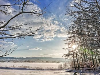 Scenic view of snow covered landscape against sky