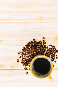 High angle view of coffee cup on table