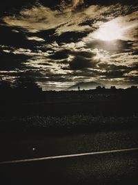 Silhouette landscape against sky at sunset