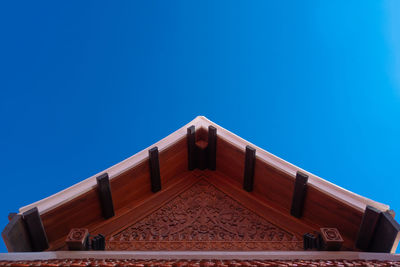 Low angle view of building against clear blue sky