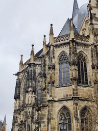 Low angle view of ornate building against sky