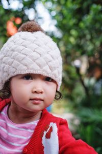 Portrait of cute girl looking away outdoors