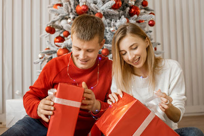 Portrait of happy family using mobile phone