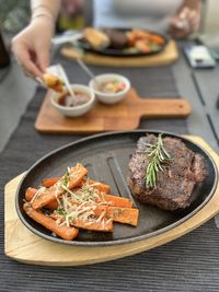 Cropped hand of person having food