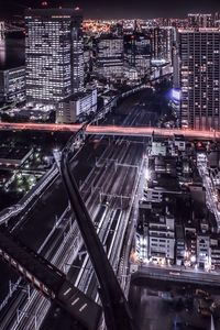 High angle view of illuminated cityscape at night