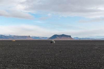 Scenic view of land against sky