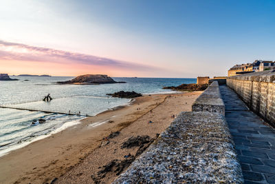 High angle view of the beach of saint-malo from ramparts at sunset. brittany, france, europe