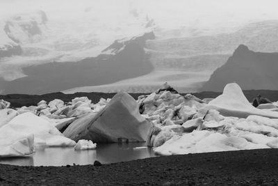 Scenic view of snow covered mountains against sky