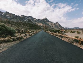 Road amidst landscape against sky