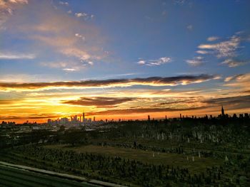 Scenic view of landscape against sky during sunset