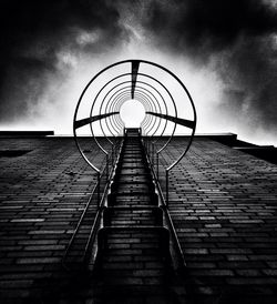 Low angle view of building against cloudy sky