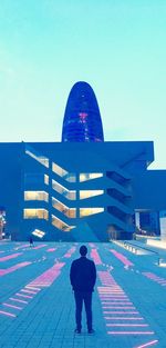 People in front of modern building
